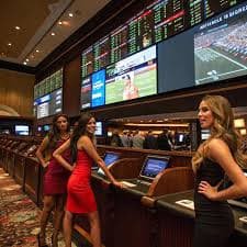 Filipino player using ug7778 on a mobile phone to browse sportsbook and slot games